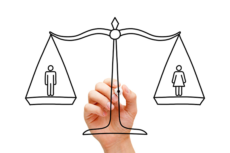 Das Bild zeigt eine Wagge im Gleichgewicht. Links ist das männliche, rechts das weibliche Geschlecht in Form von Strichzeichnungen dargestellt.